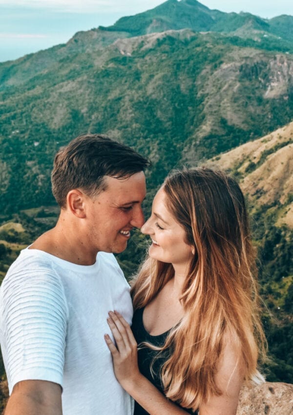 Couple standing at little Adams Peak viewpoint.