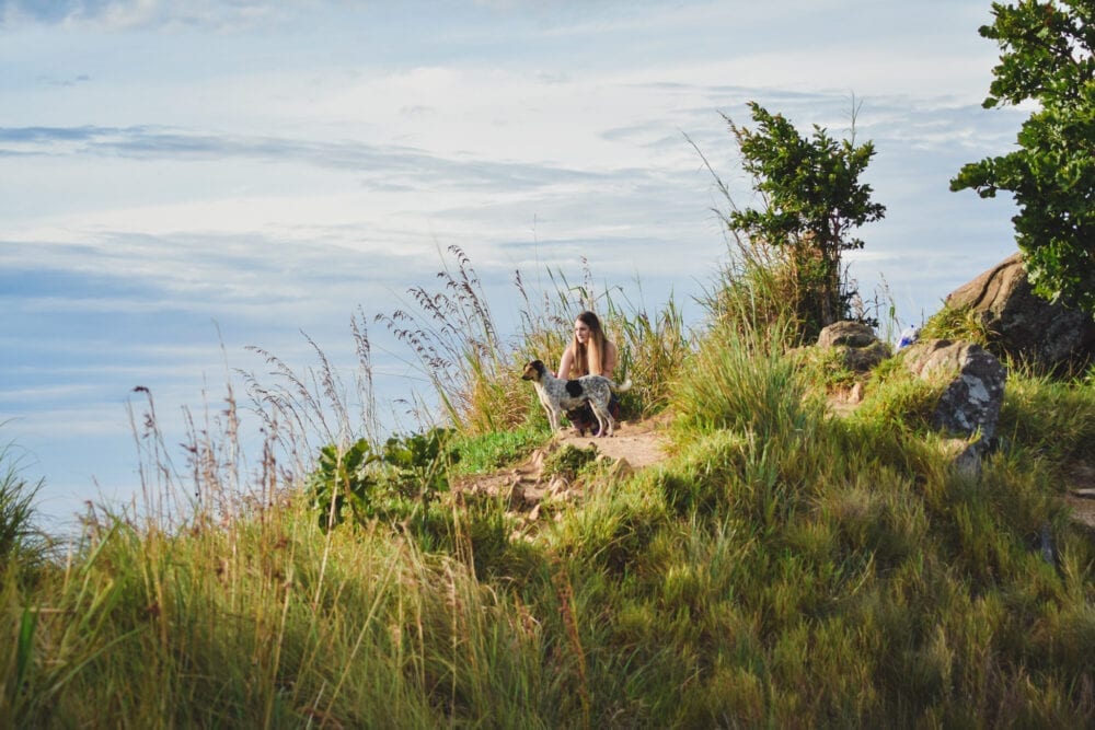 Little Adams Peak for sunrise. Girl with dog at the top of Little Adams Peak 