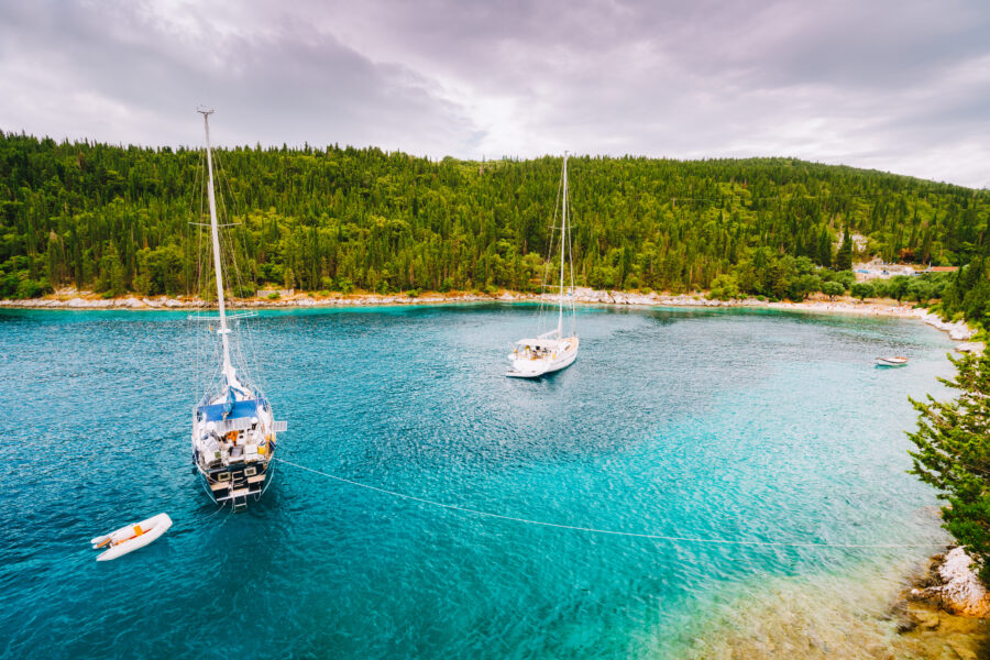 Fiskardo, Foki beach near small town Fiskardo at Kefalonia, Ionian islands, Greece. Private yacht boats in the small lagoon. 