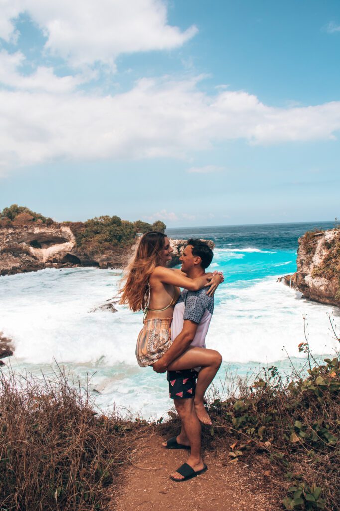 Couple embracing at blue lagoon, one of the best things to do in Nusa Lembongan.